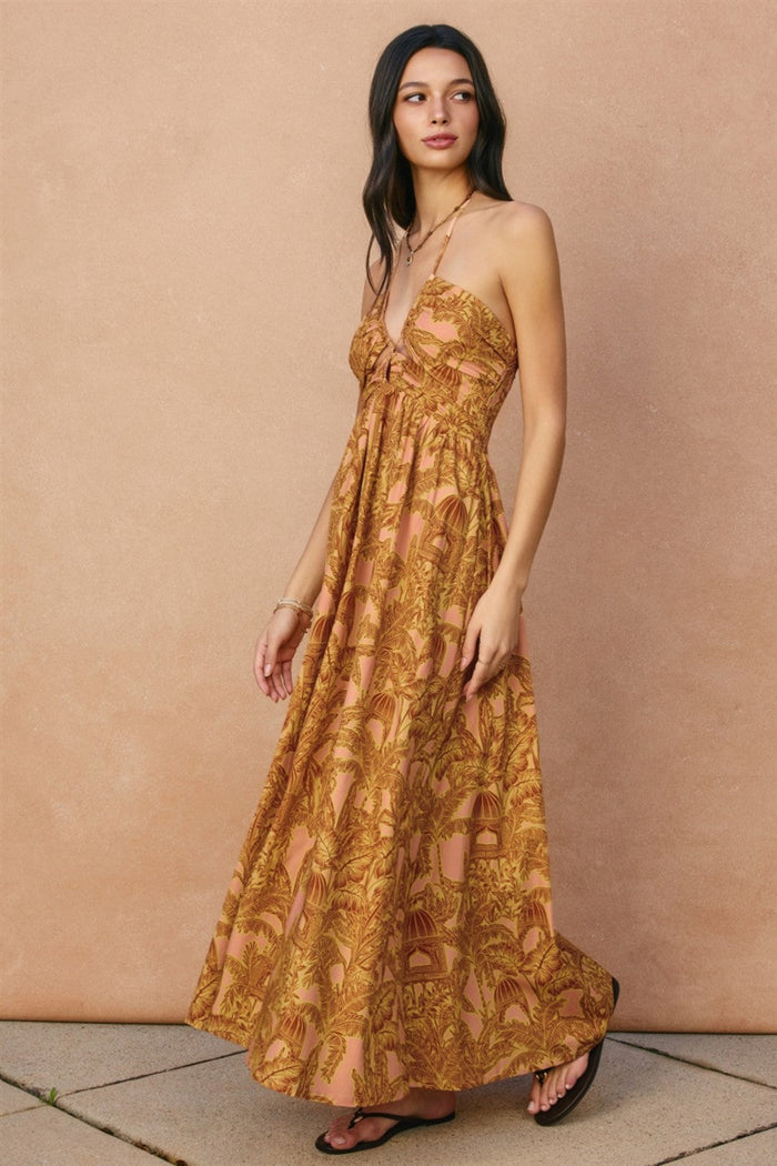 Gold and tan floral print halter maxi dress with ruched bodice and cutout details.