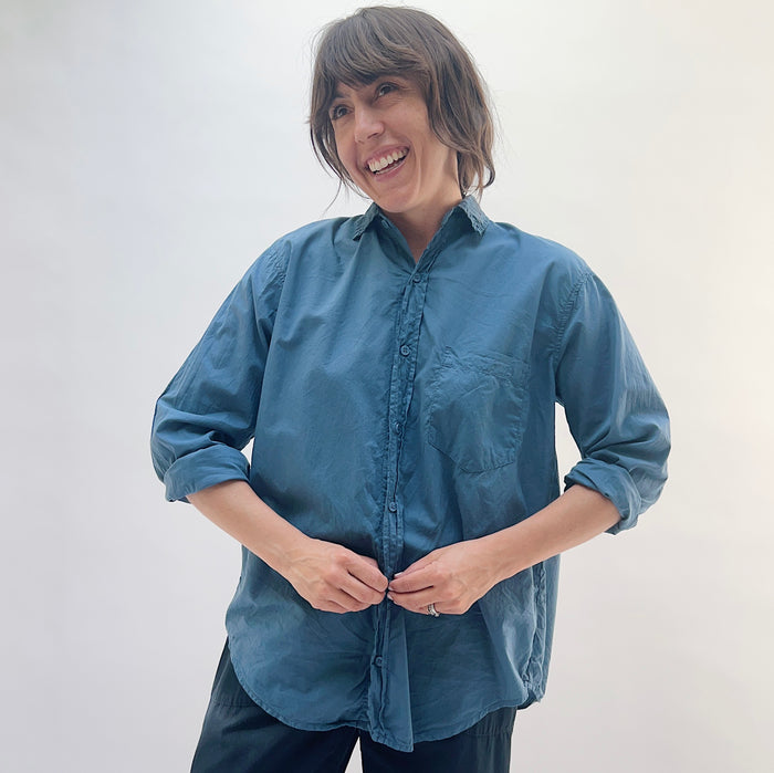 Front view of the Alix Top in Moonlit Ocean, a boxy teal button-front shirt with a point collar, chest pocket, and rolled sleeves