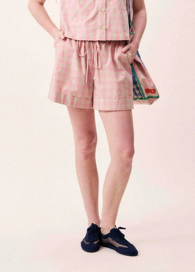 Pink and green plaid pull-on shorts with drawstring waist and side pockets.