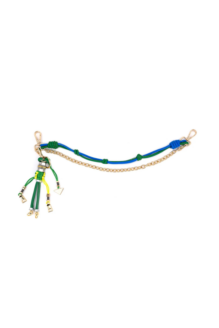 Blue and green braided cord connector with gold chain links and tassel charm featuring multiple colored straps and metal acce
