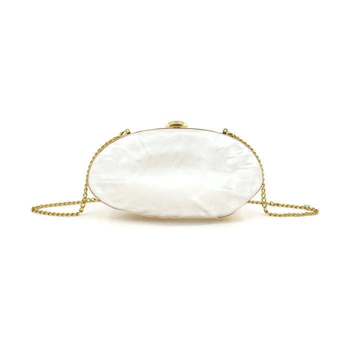 White pearl oval clutch with gold-tone chain straps and metal frame closure.
