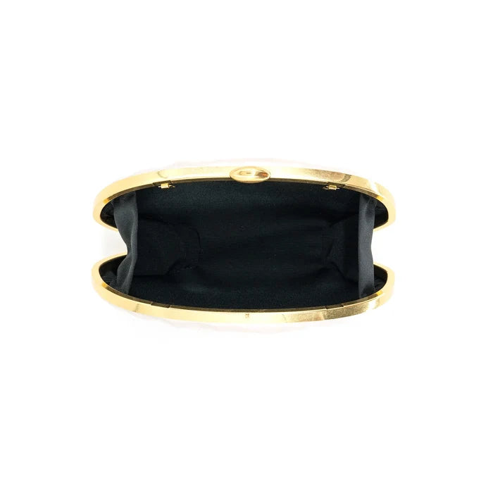 Gold-toned clutch with black interior and snap closure, shown open from above.