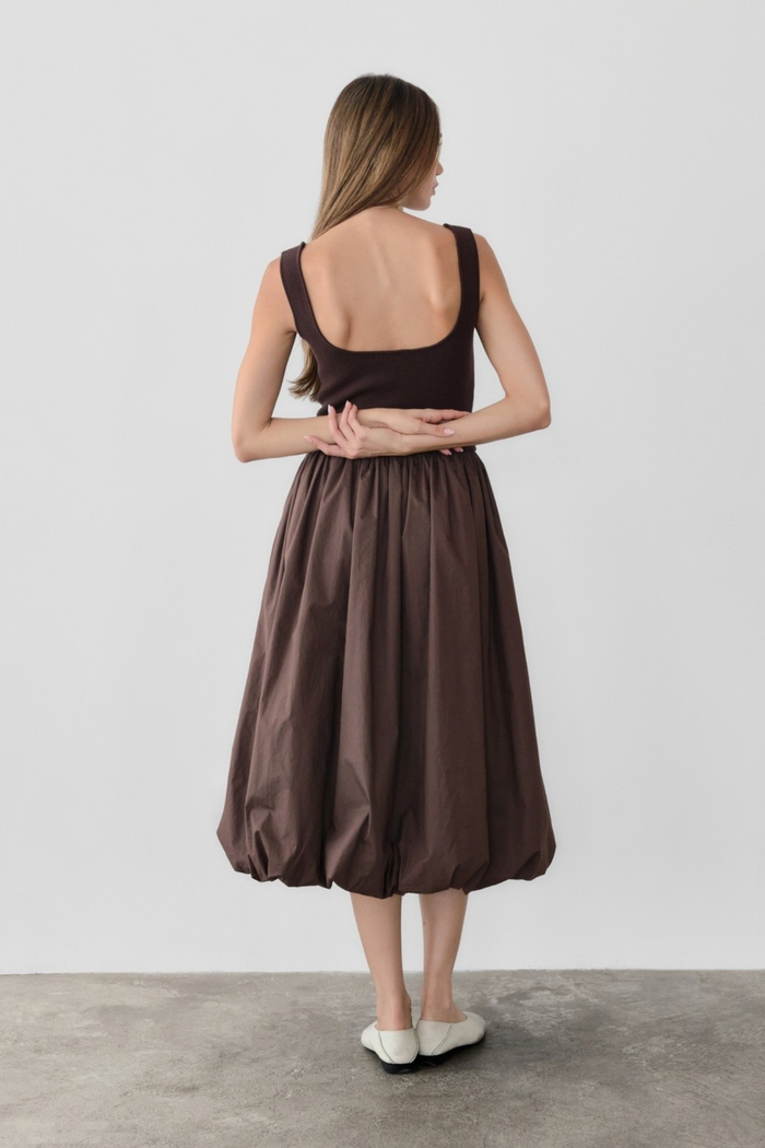 Brown sleeveless midi dress with fitted bodice and full gathered skirt, shown from back on model.
