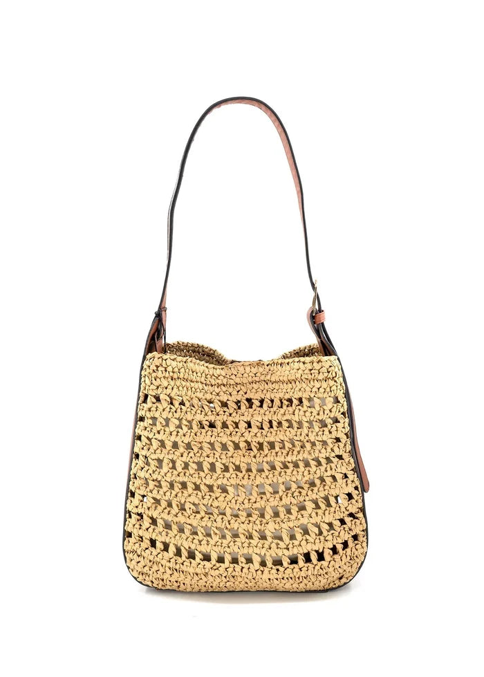 Tan crochet straw shoulder bag with brown leather handles and open weave pattern.