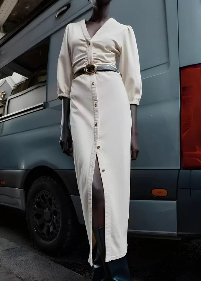 White button-front midi dress with puffed three-quarter sleeves and belted waist on mannequin.