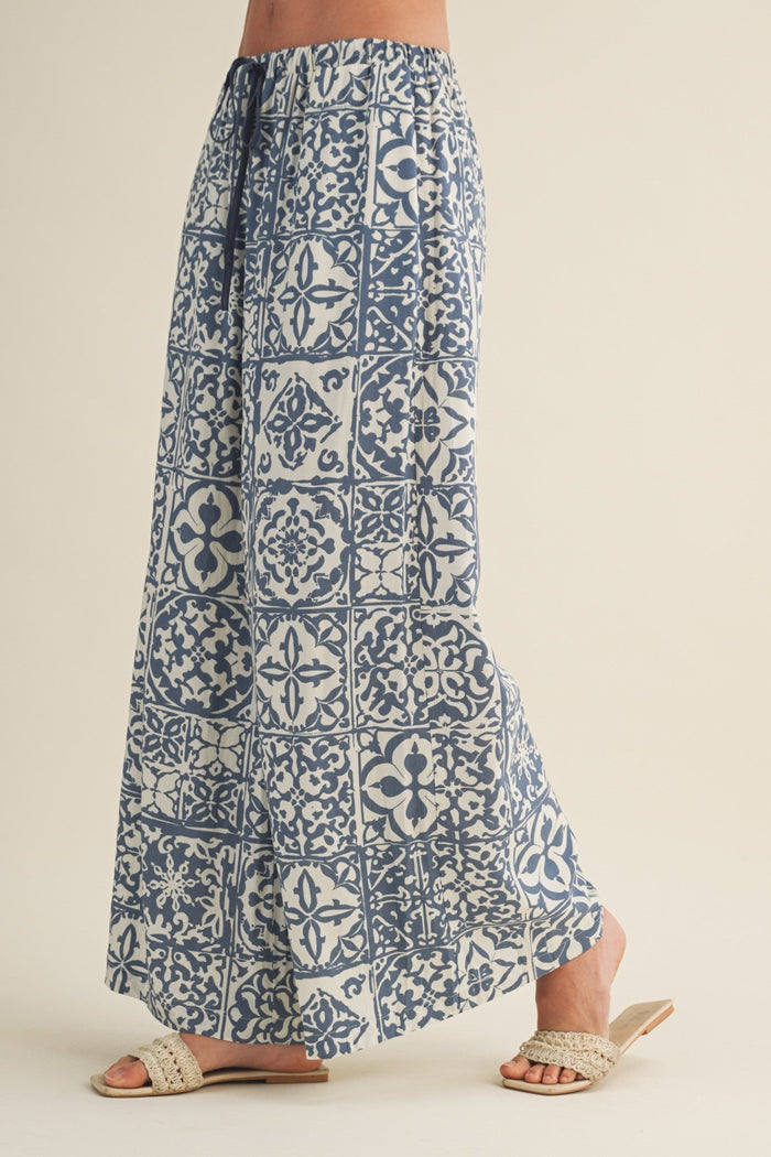 Blue and white patterned skirt on a neutral background