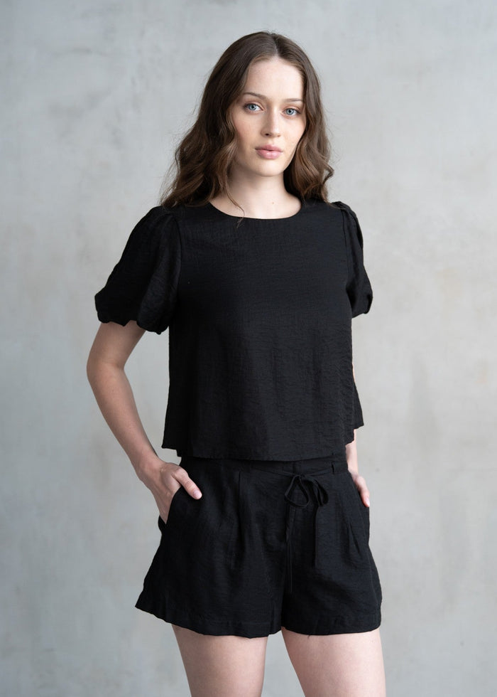 Black t-shirt with gathered puff sleeves and crew neckline.