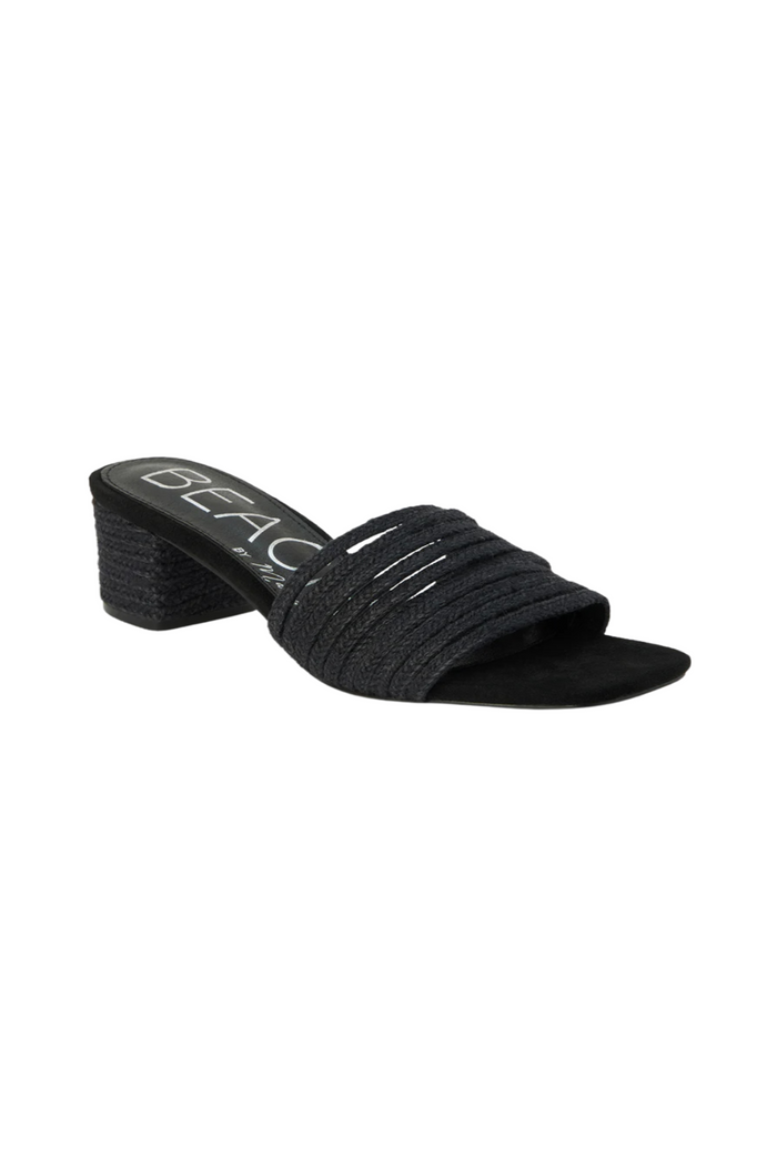 Black slide sandal with textured fabric upper and chunky block heel.