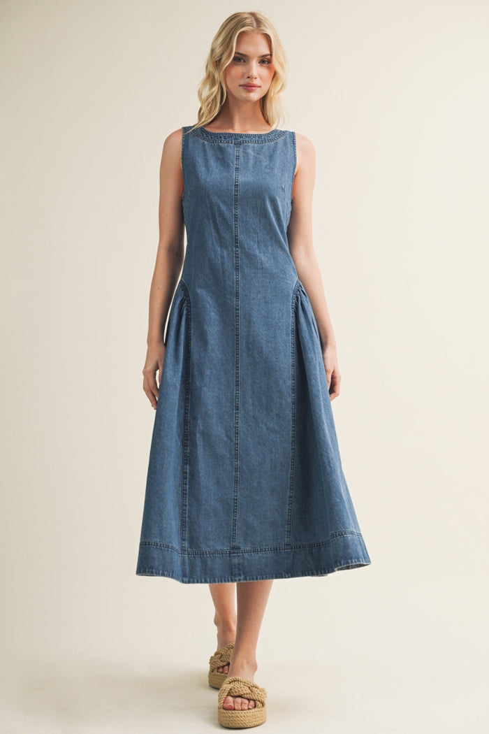 Blue denim sleeveless midi dress with center seam detail and A-line silhouette.