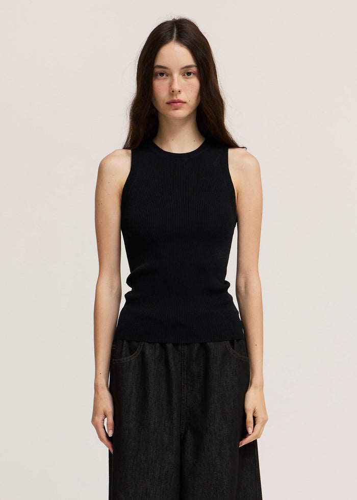 Black ribbed knit sleeveless tank top with crew neckline on model.