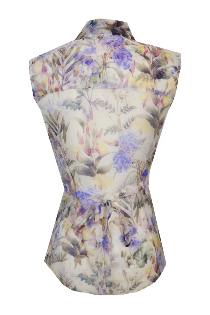 Sleeveless button-down blouse with floral print in purple, pink, yellow and brown tones on cream background.