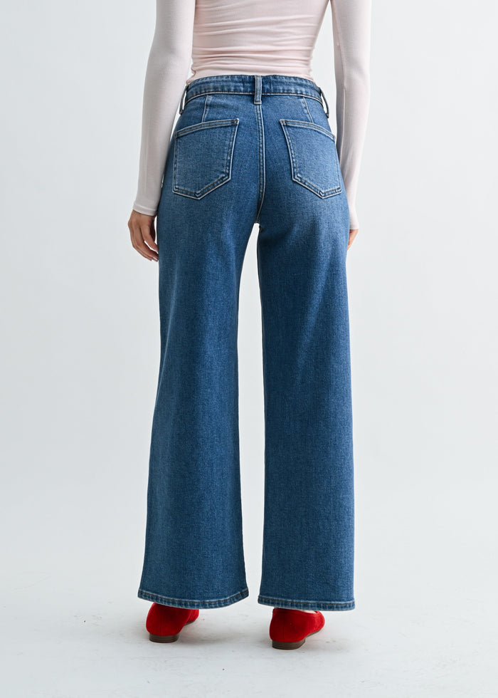 Blue high-rise jeans with straight wide-leg silhouette, back patch pockets, and contrast stitching.