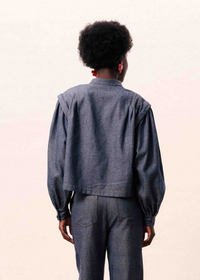 Navy blue button-up shirt with long sleeves and cropped silhouette, shown from back view.