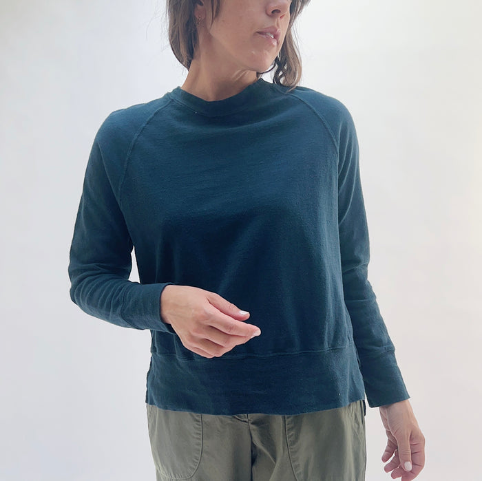 Raglan Sweatshirt in Ink — front view, cropped boxy silhouette with mock neck and raglan sleeves, styled with olive trousers