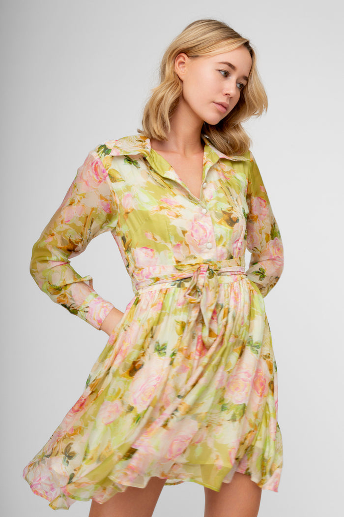 Lime shirt dress with pink floral print, long sleeves, collar, and tie waist belt.