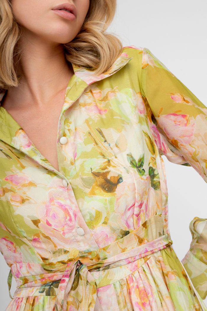 Lime green wrap dress with pink, yellow, and orange floral print, featuring long sleeves, collar, and self-tie belt.