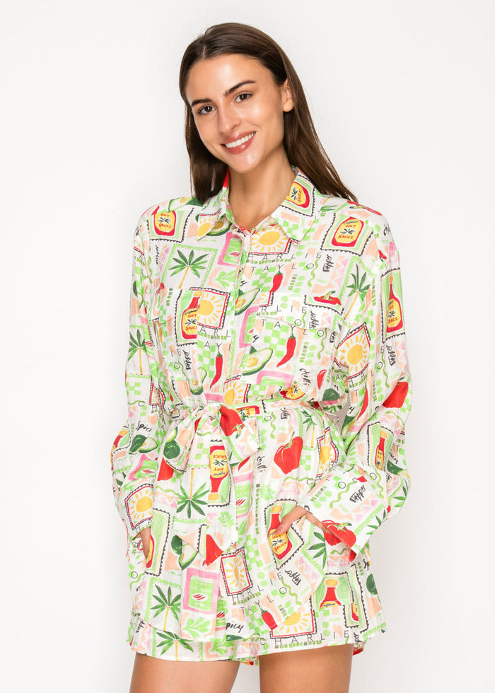 Long-sleeve button-up top with colorful all-over print featuring peppers, plants, and geometric shapes in red, green, and yel