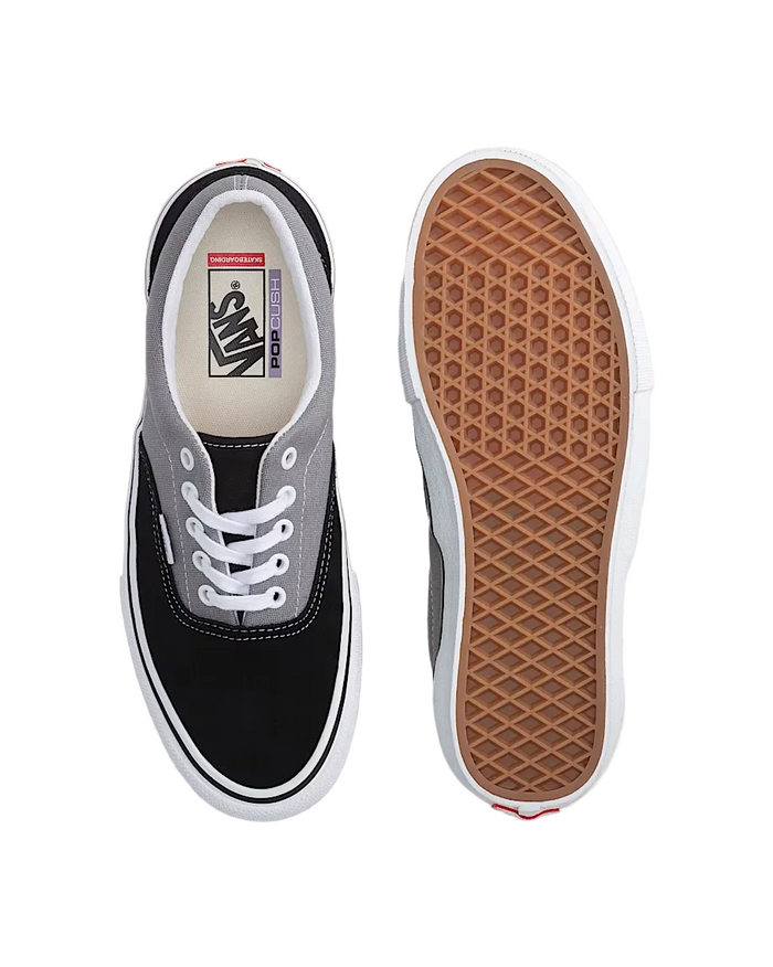 Black and gray Vans sneaker with a brown sole on a light background