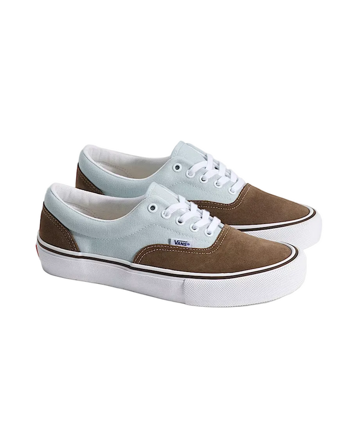 Pair of brown and light blue sneakers on a white background
