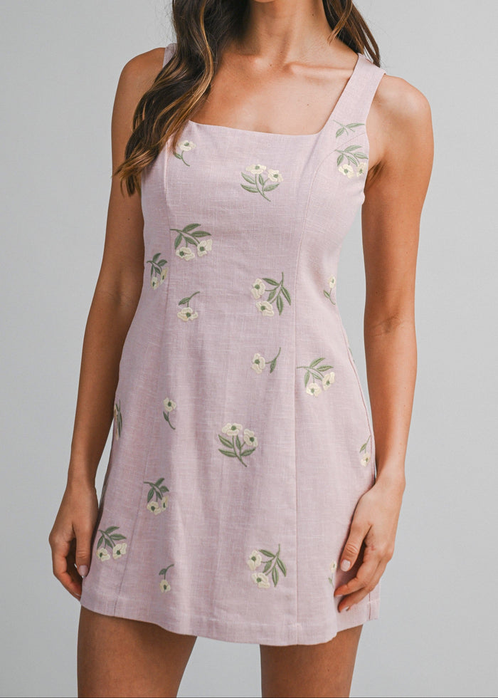 Lavender mini dress with square neckline, sleeveless cut, and white flower embroidery throughout.