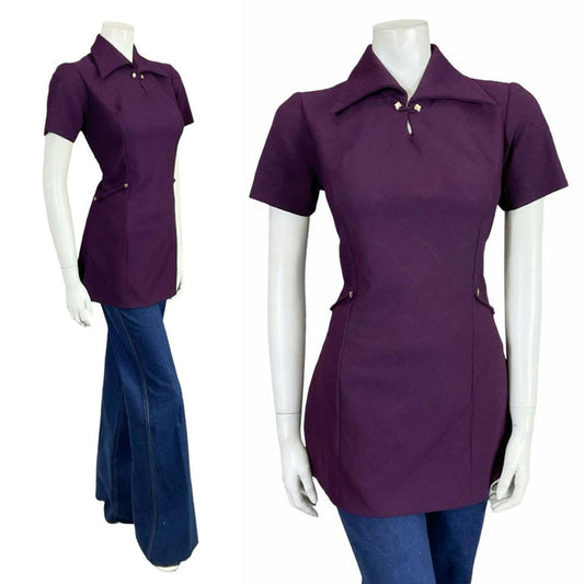 Shrinking Violets Vintage 60s 70s aubergine purple mod dagger collar space age blouse on a white mannequin wearing blue flared jeans