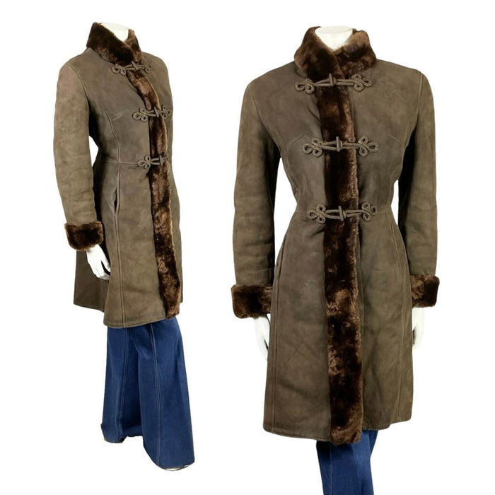 Shrinking Violets vintage 60s 70s brown suede Dr. Zhivago coat on a white mannequin wearing blue flared jeans