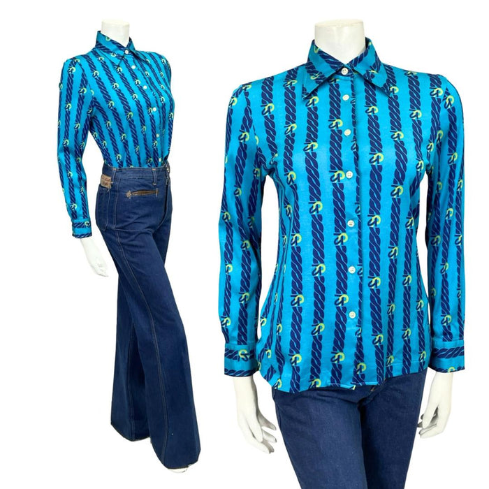 Mannequin wears a blue 60s 70s chain print dagger collar shirt with blue flared jeans