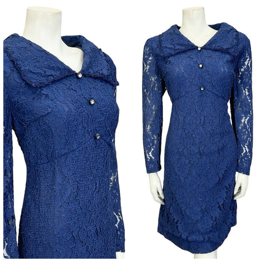 Mannequin wears a navy blue lace 60s 70s long sleeve diamante button empire mini shirt dress.
