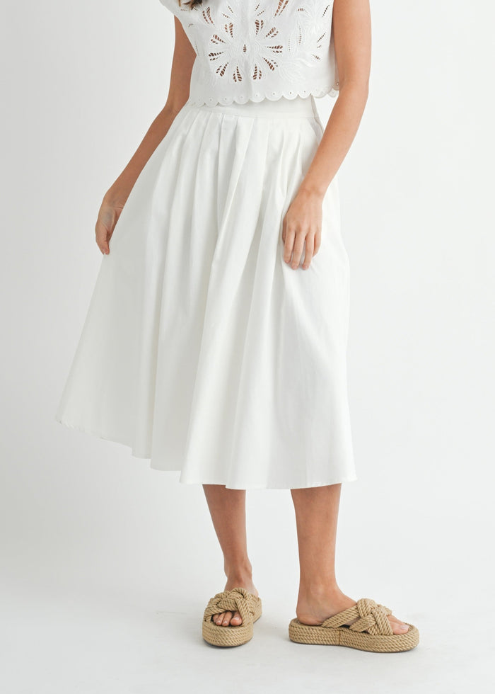 MABLE WHITE MIDI SKIRT – A CLEAN, LINEN-BLEND MIDI WITH A FLATTERING PLEATED WAIST AND STREAMLINED SILHOUETTE