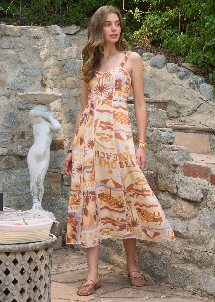 Sleeveless midi dress with orange and pink graphic print and adjustable straps.